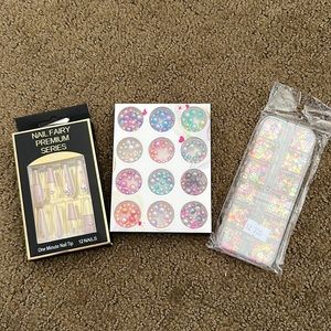 Long press on nails with nail charms.